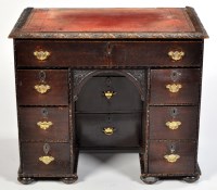 Lot 1102 - An 18th Century oak kneehole desk, with later...