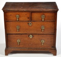 Lot 1115 - An early 18th Century oak chest of two short...