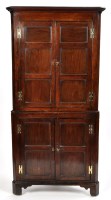 Lot 1126 - An 18th Century oak corner cupboard, the...