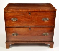 Lot 1141 - A Georgian mahogany chest of two deep drawers,...