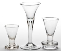 Lot 11 - Two firing glasses, with funnel bowls, heights...