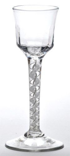 Lot 27 - A mixed twist wine glass, the waisted ogee...