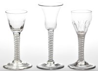 Lot 30 - Three opaque twist glasses, with bell and...