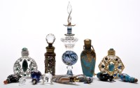 Lot 44 - Eleven coloured miniature glass scent bottles...