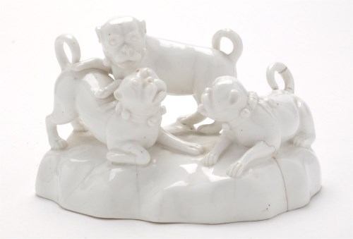 Lot 134 - Continental Whiteware model of three pug dogs...