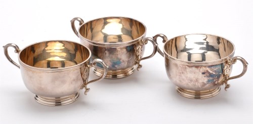 Lot 629 - Three Elizabeth II two-handled bowls, by B.S.C....