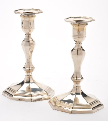 Lot 647 - A pair of Edwardian candlesticks, by...