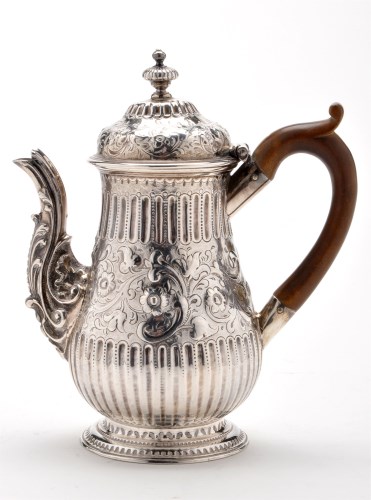 Lot 652 - A George III coffee pot, by I.S., London 1770,...