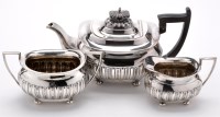 Lot 657 - An early 20th Century three-piece tea service,...