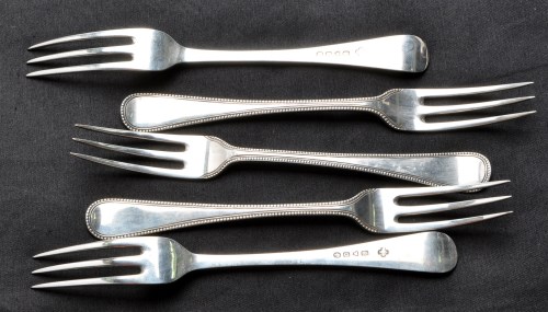 Lot 681 - Five Victorian three pronged table forks, by...