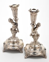 Lot 733 - A pair of Continental white metal candlesticks,...