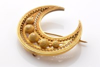 Lot 755 - A Victorian filigree crescent brooch, yellow...