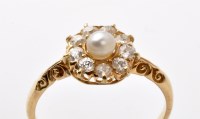 Lot 758 - A pearl and diamond cluster ring, the central...