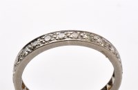 Lot 768 - A diamond eternity ring, the eight-cut...