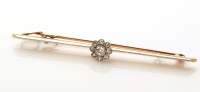 Lot 772 - A diamond cluster bar brooch, the central...