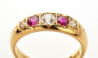 Lot 774 - A diamond and ruby ring, the three graduated...