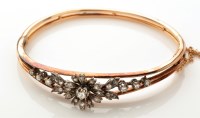 Lot 777 - A French diamond set bangle, the front of...
