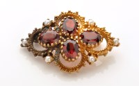 Lot 779 - A garnet, seed pearl and 9ct. yellow gold...