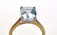 Lot 783 - An aquamarine ring, the oval facet cut...