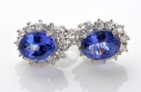 Lot 785 - A pair of tanzanite and diamond cluster...