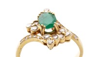 Lot 791 - An emerald and diamond ring, the central oval...