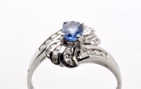 Lot 796 - A sapphire and diamond dress ring, the oval...