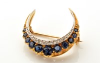 Lot 800 - A sapphire and diamond crescent pattern brooch,...