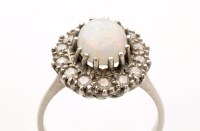 Lot 804 - An opal and diamond cluster ring, the oval...