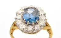 Lot 805 - A sapphire and diamond cluster ring, weighing...