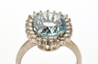 Lot 807 - An aquamarine and diamond cluster ring,...