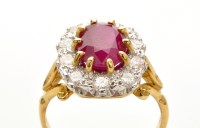 Lot 809 - A ruby and diamond cluster ring, weighing...