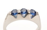 Lot 821 - A sapphire and diamond ring, three circular...