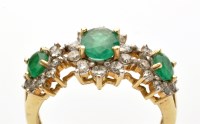 Lot 822 - An emerald and diamond triple cluster ring,...