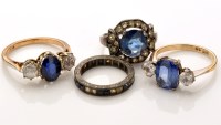 Lot 829 - Four blue and white stone rings, to include:...