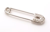 Lot 831 - A diamond and 18ct. white gold safety pin...