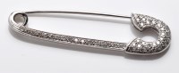 Lot 832 - A diamond safety pin pattern brooch, set...