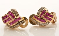 Lot 837 - A pair of ruby and diamond ear clips, set with...