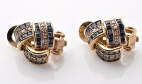 Lot 840 - A pair of sapphire and diamond knot pattern...