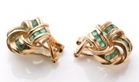 Lot 843 - A pair of emerald and yellow metal knot...