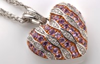 Lot 845 - A diamond and pink sapphire heart pattern...