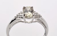 Lot 860 - A zultanite and diamond ring, the oval facet...