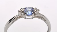 Lot 862 - A tanzanite and diamond ring, the oval facet...