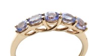 Lot 863 - A five stone tanzanite ring, the oval faceted...