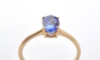 Lot 864 - A tanzanite ring, the oval facet cut tanzanite...