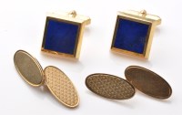 Lot 879 - A pair of 9ct. yellow gold cufflinks, each...