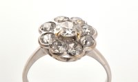 Lot 883 - A diamond cluster ring, the central old cut...