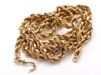 Lot 886 - A yellow metal twist link muff chain with...