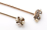 Lot 896 - A diamond and pearl set crown pattern stick...