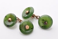 Lot 899 - A pair of jadeite cufflinks, with yellow metal...