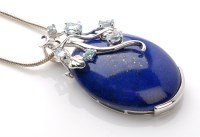 Lot 909 - A lapis lazuli and aquamarine set drop pendant,...